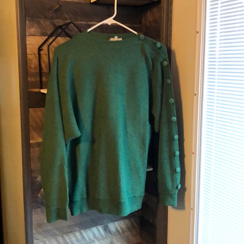 Sweater with button detail.